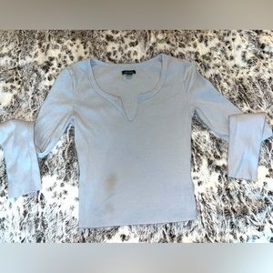 blue long sleeve shirt size xs with a small stain on the bottom left